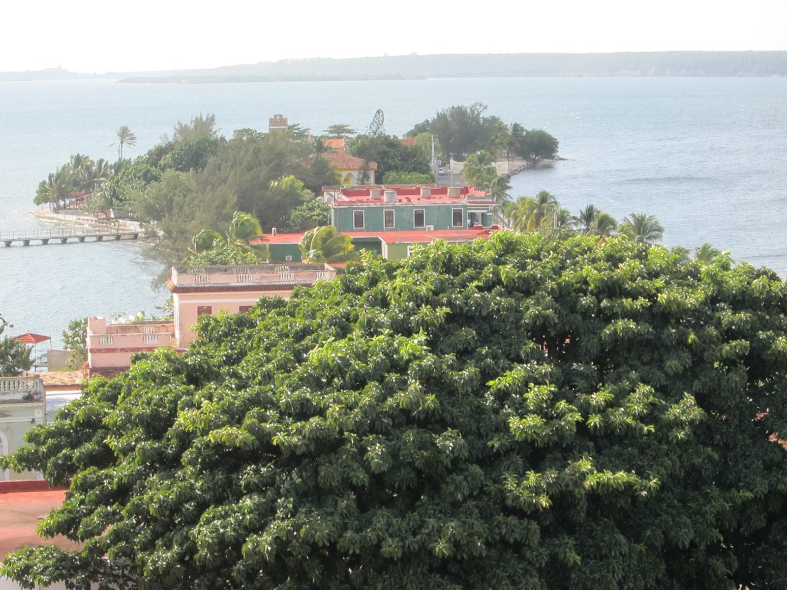 This is Punta Gorda which juts out from Cienfuegos.  The restaurant with the cigars has a red roof.